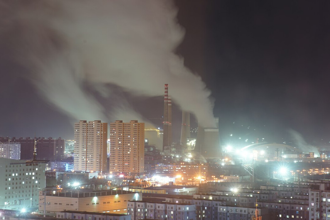 researcher measuring air quality