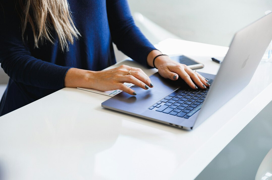 person verifying facts on laptop